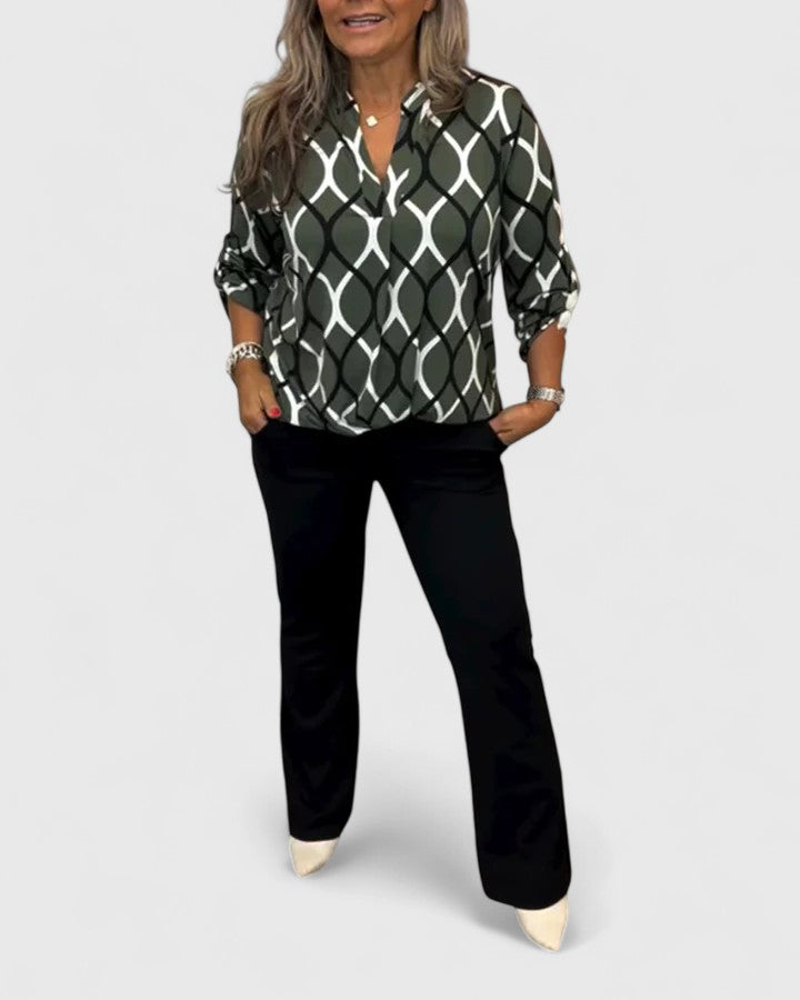 Women’s sophisticated blouse with elegant detailing and a relaxed fit, suitable for office outfits, casual wear, and smart occasions.