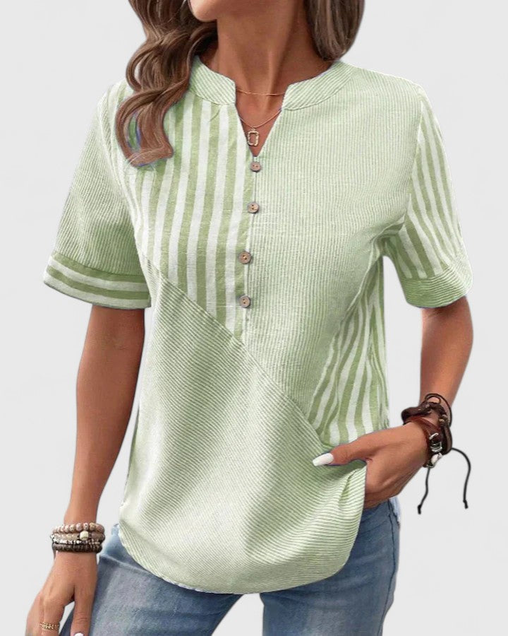 Women’s striped blouse with relaxed fit and classic design, ideal for office wear, casual outings, and everyday styling.