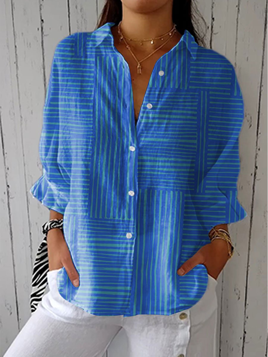Women’s striped blouse with V-neckline, button front, and relaxed silhouette, suitable for office wear, casual outings, and everyday styling.