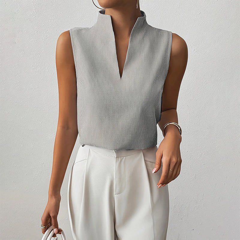 Women’s striped blouse with V-neckline, stand collar, and sleeveless design, suitable for office wear, business casual outfits, and everyday styling.