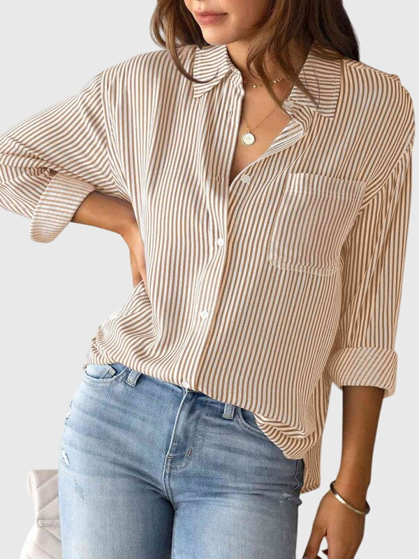 Women’s striped shirt with a collared neckline, button closure, and tailored fit, ideal for office wear, casual outings, and smart-casual occasions.