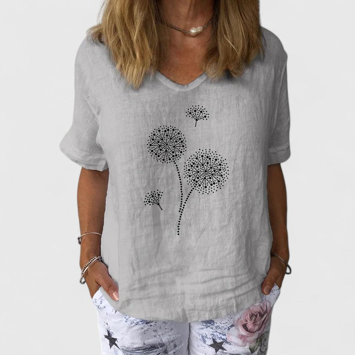 Women’s summer blouse with a loose fit and print design, suitable for casual outfits, travel wear, and warm-weather styling.