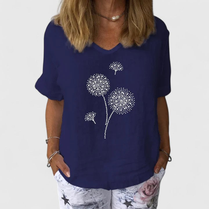 Women’s summer blouse with a loose fit and print design, suitable for casual outfits, travel wear, and warm-weather styling.