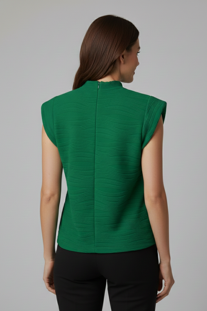 Women’s sleeveless top with stand collar, extended shoulders, and textured surface, suitable for office wear and everyday outfits.
