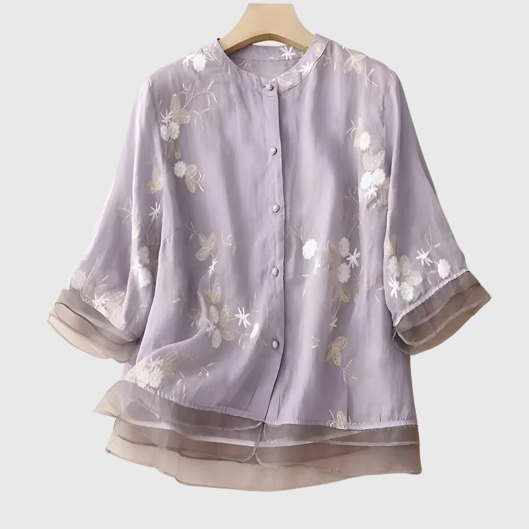 Women’s top with floral embroidery and a relaxed fit, ideal for casual outings, smart-casual occasions, and everyday styling.