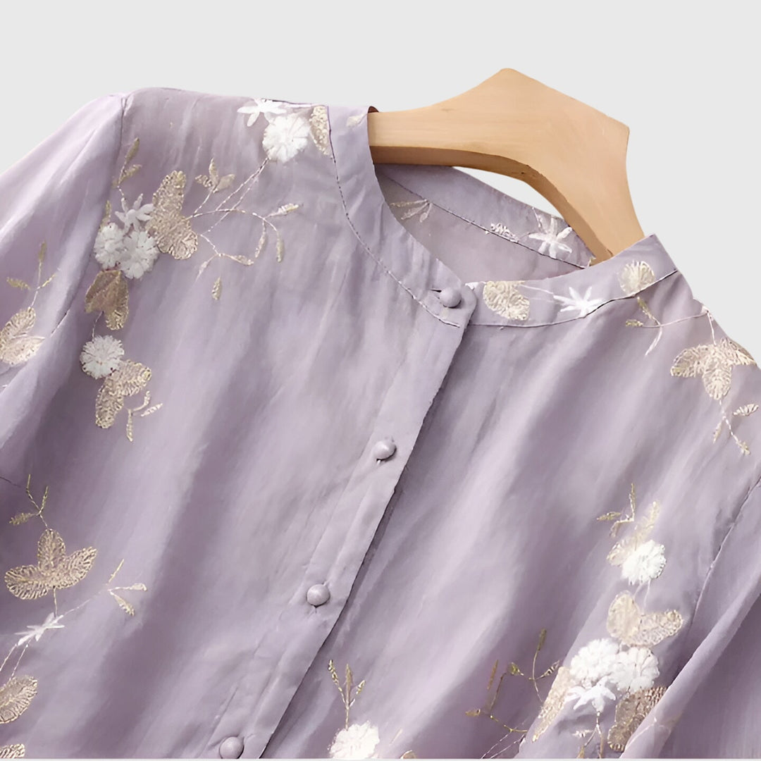 Women’s top with floral embroidery and a relaxed fit, ideal for casual outings, smart-casual occasions, and everyday styling.