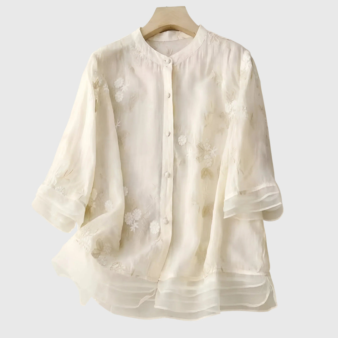 Women’s top with floral embroidery and a relaxed fit, ideal for casual outings, smart-casual occasions, and everyday styling.