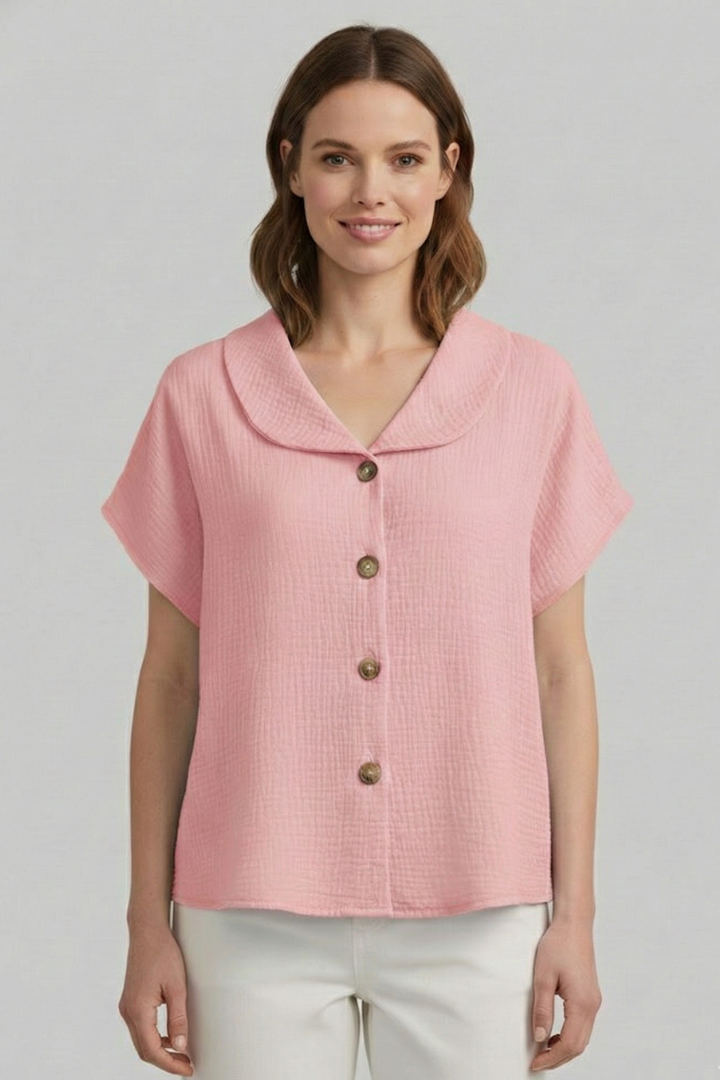 Women’s short sleeve top with V-neckline, front button detail, and textured surface, suitable for casual wear and everyday styling.