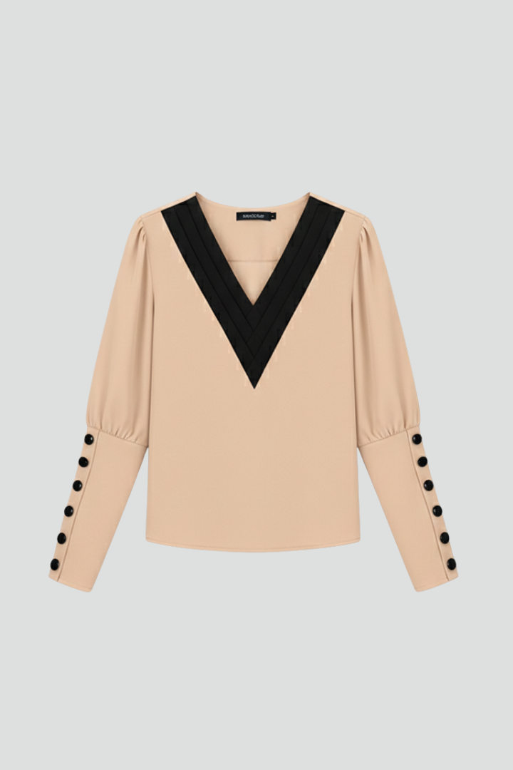 Women’s V-neck blouse with contrast trim, wrap-style front, and cuff buttons, featuring a color block design for office or everyday wear.