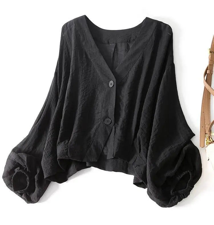 Women’s v-neck blouse with batwing sleeves and a loose fit, suitable for summer outfits, casual wear, and relaxed everyday styling.
