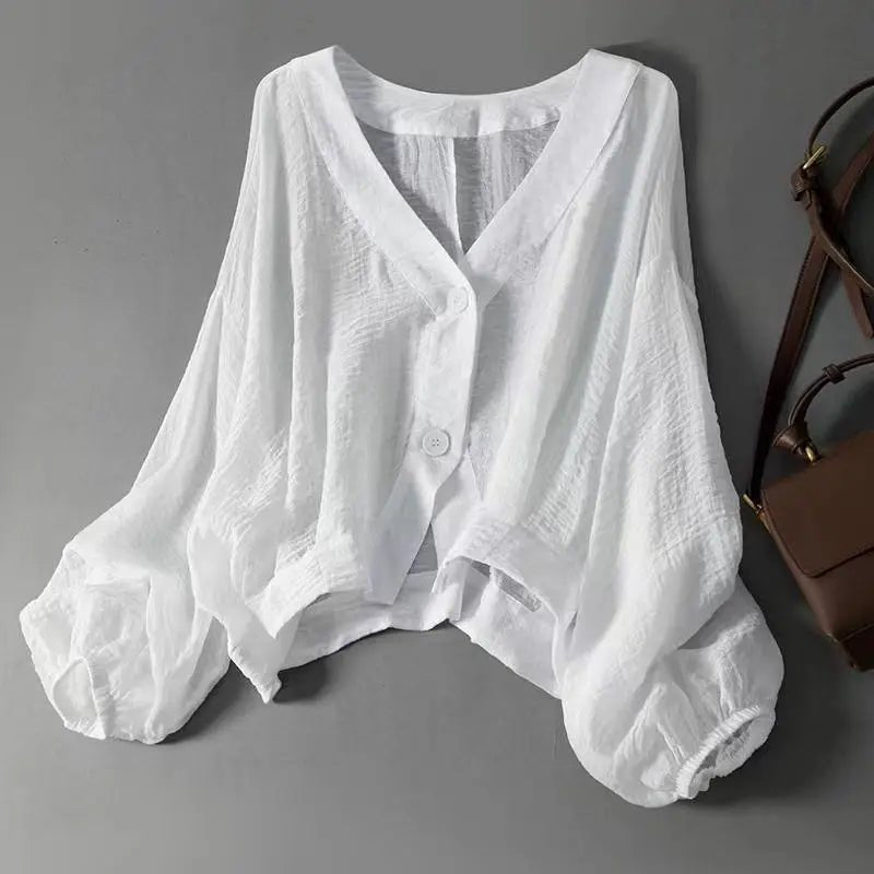 Women’s v-neck blouse with batwing sleeves and a loose fit, suitable for summer outfits, casual wear, and relaxed everyday styling.