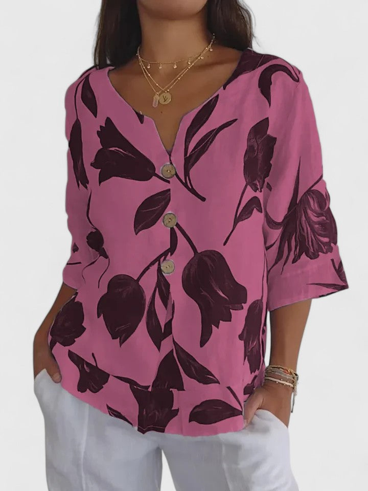 Women’s v-neck blouse with a floral print and relaxed fit, suitable for casual outfits, office wear, and evening occasions.