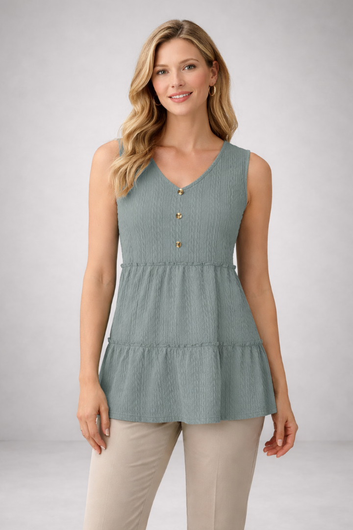 Women’s long sleeve top with v-neckline and tiered hem, featuring a textured surface for casual wear and office outfits