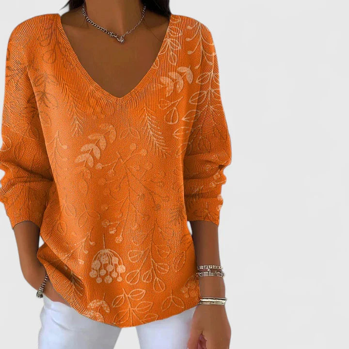 Women’s V-neck top with an autumn-inspired print and relaxed fit, ideal for casual outings, leisure wear, and everyday styling.