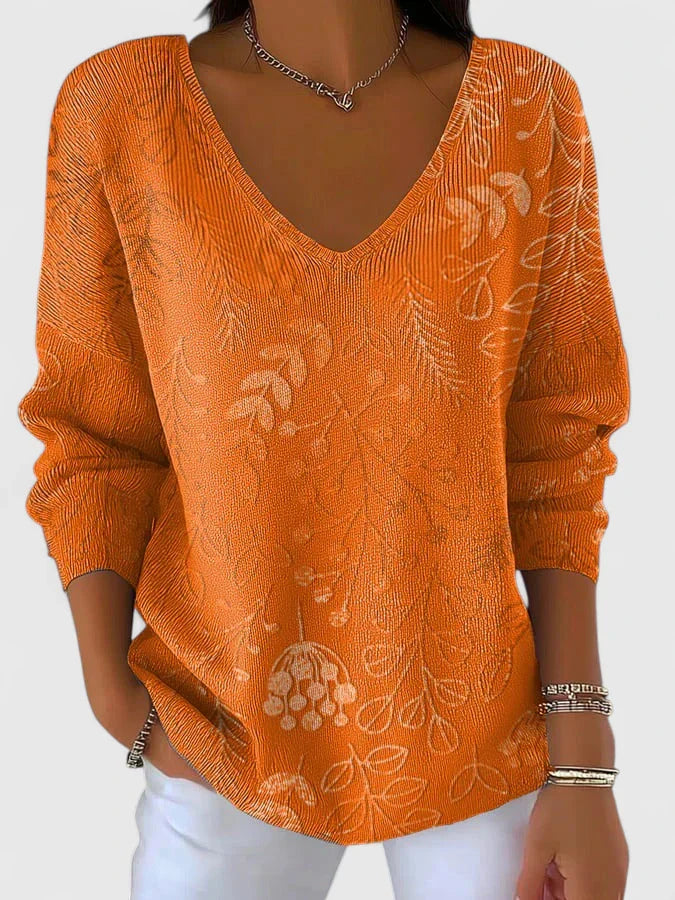Women’s V-neck top with an autumn-inspired print and relaxed fit, ideal for casual outings, leisure wear, and everyday styling.