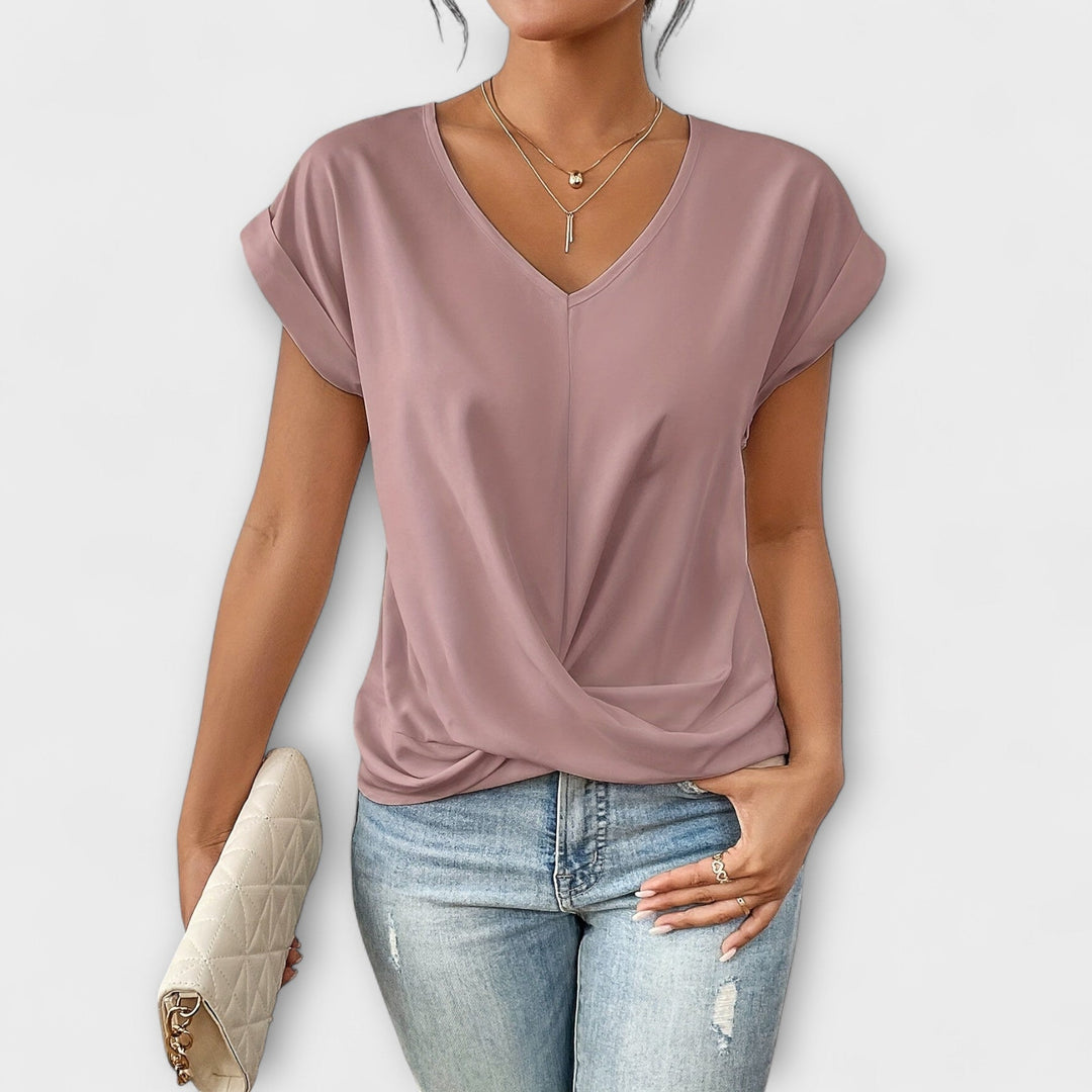 Women’s V-neck top with button detail and a flattering fit, ideal for office wear, casual outings, and smart-casual styling.