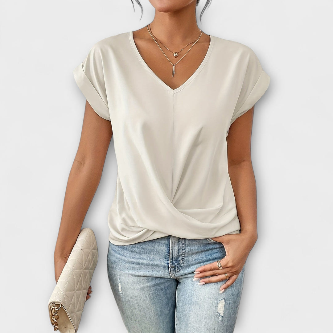 Women’s V-neck top with button detail and a flattering fit, ideal for office wear, casual outings, and smart-casual styling.