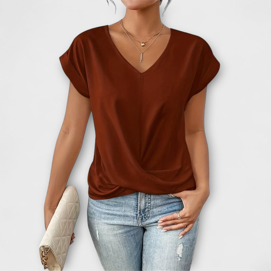 Women’s V-neck top with button detail and a flattering fit, ideal for office wear, casual outings, and smart-casual styling.