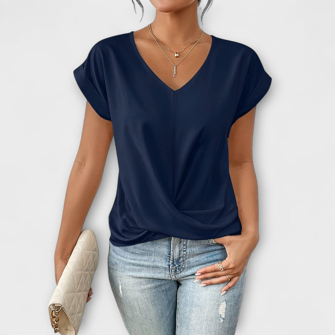Women’s V-neck top with button detail and a flattering fit, ideal for office wear, casual outings, and smart-casual styling.